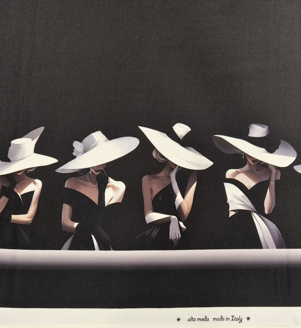 Black Italian silk-and-wool fabric printed with a row of women in wide-brimmed white hats and off-shoulder gowns, "alta moda made in Italy" along the selvedge