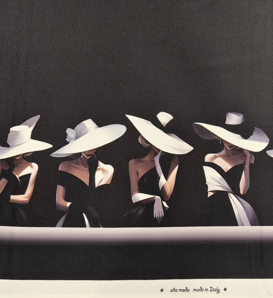 Black Italian silk-and-wool fabric printed with a row of women in wide-brimmed white hats and off-shoulder gowns, "alta moda made in Italy" along the selvedge