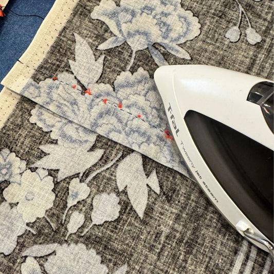 Iron pressing delicate floral fabric during a traditional kimono class in Japan — After Stilettos Inside a Traditional Kimono Class