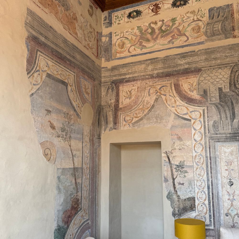 Ornate Italian fresco interior with elaborate painted walls and decorative architectural details — After Stilettos French Couture Jacket Workshop