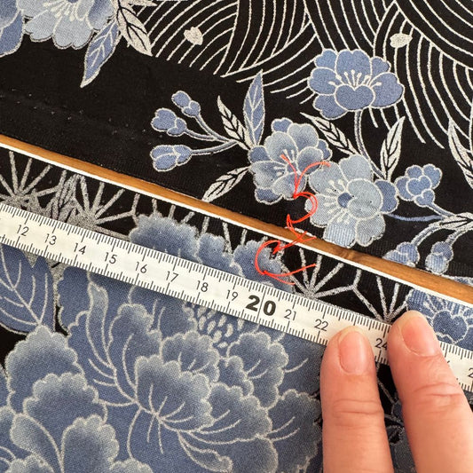 Hand measuring intricate lace fabric with a ruler — After Stilettos Making a Traditional Kimono by Hand in Japan