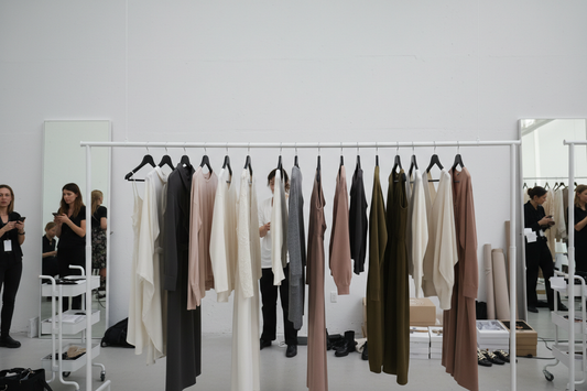 New York Fashion Week 2024 backstage showing garment preparation and last-minute adjustments before runway show