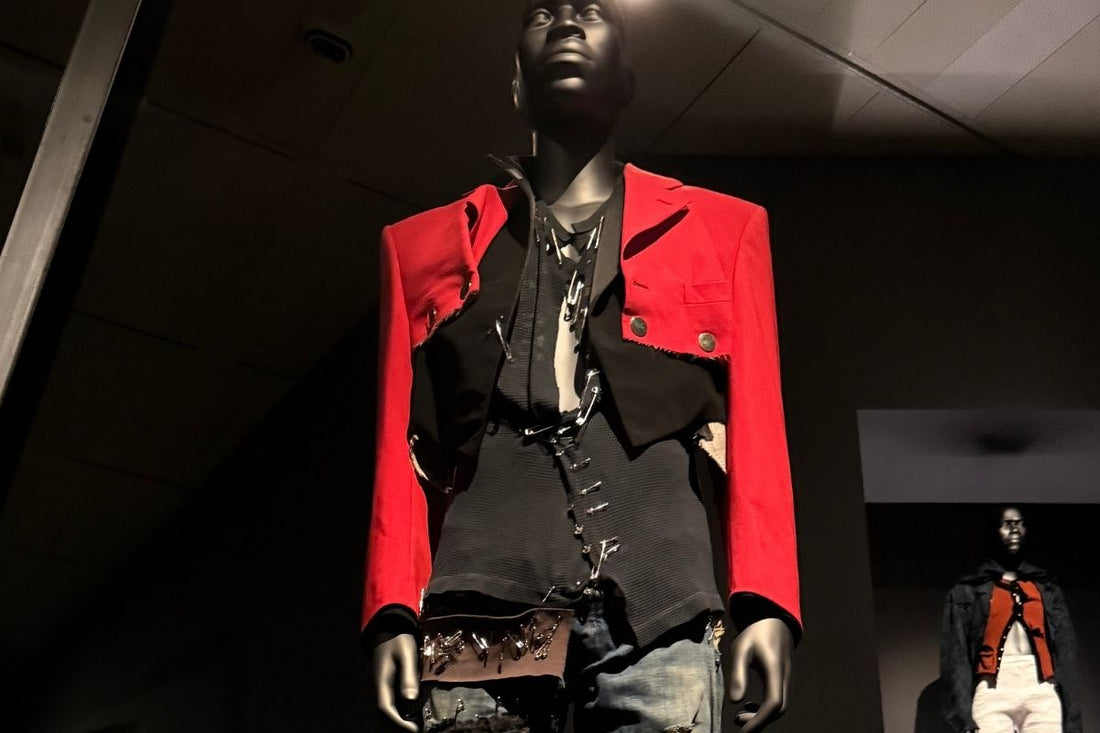 Superfine: Tailoring Black Style exhibition at The Met Costume Institute, New York — mannequin dressed in a structured red jacket and black tailored ensemble