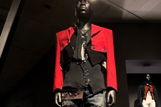 Superfine: Tailoring Black Style exhibition at The Met Costume Institute, New York — mannequin dressed in a structured red jacket and black tailored ensemble
