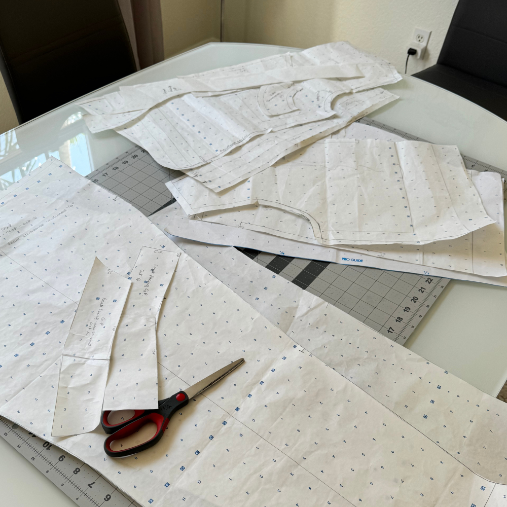 Pattern making blocks and drafting tools showing bodice, skirt, trouser, and sleeve foundation patterns with dart manipulation examples from fashion school