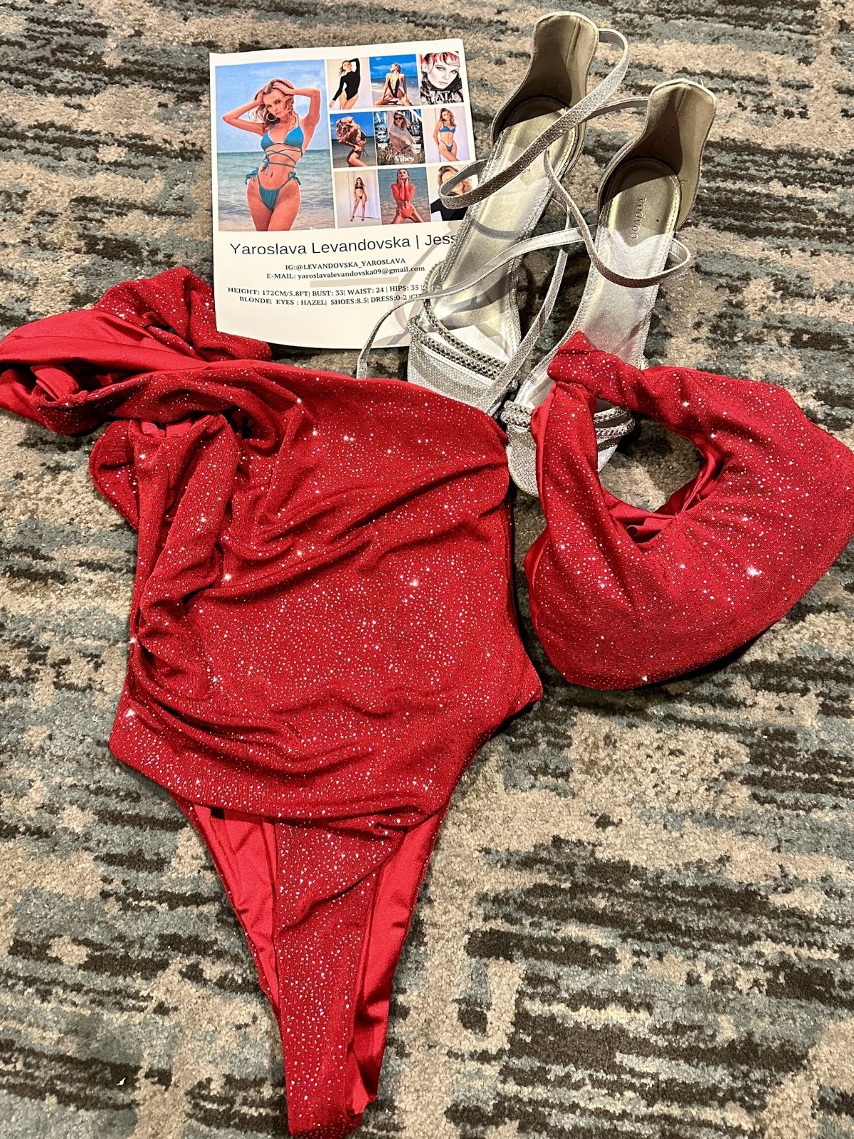After Stilettos Ember Line one-shoulder sequin bikini set laid flat with silver heeled sandals and lookbook card
