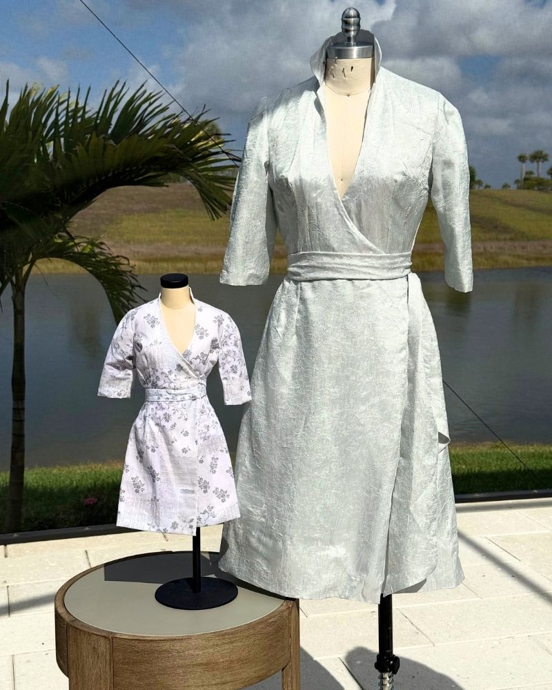 Silver brocade kimono wrap dress and miniature version on dress forms, made by Nicola Grayling at the Fashion Institute of Florida