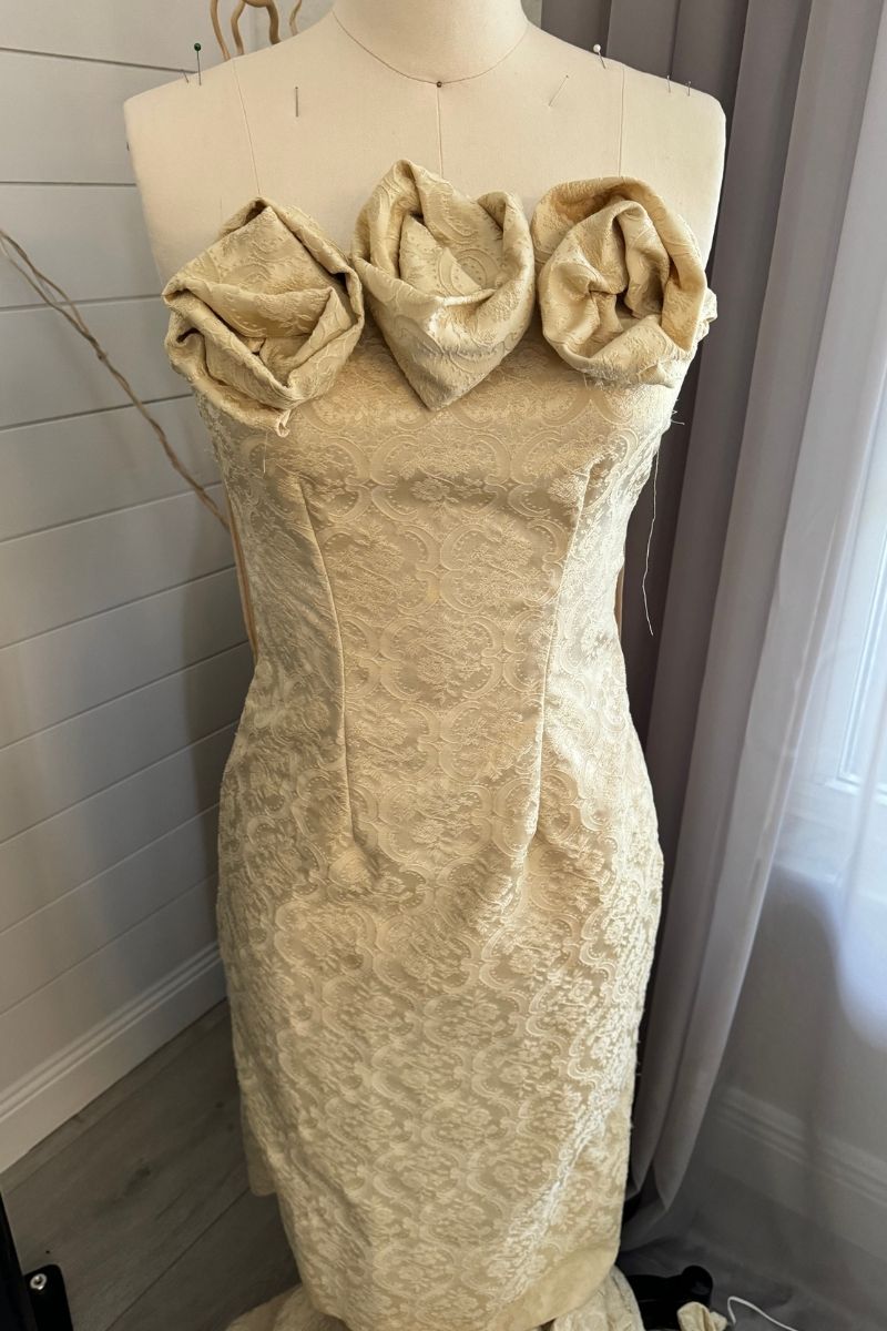 Shadow Blossom ivory brocade strapless gown with sculptural rose bodice on dress form, After Stilettos atelier