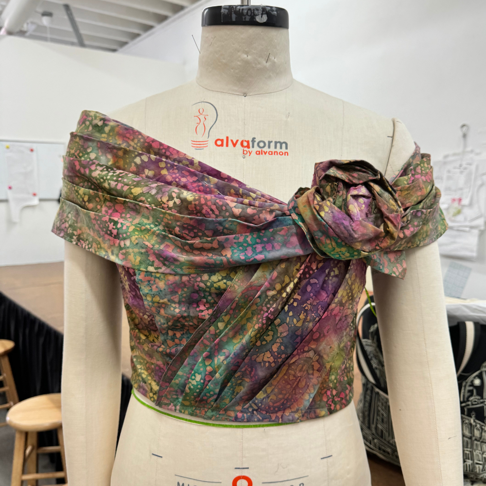 A draped garment on a dress form, reflecting style and intention through fabric, proportion, and thoughtful design