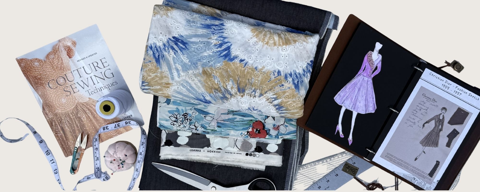 Couture Sewing Techniques book, fabric swatches, tape measure, scissors and Christian Dior fashion sketches flatlay — After Stilettos journal